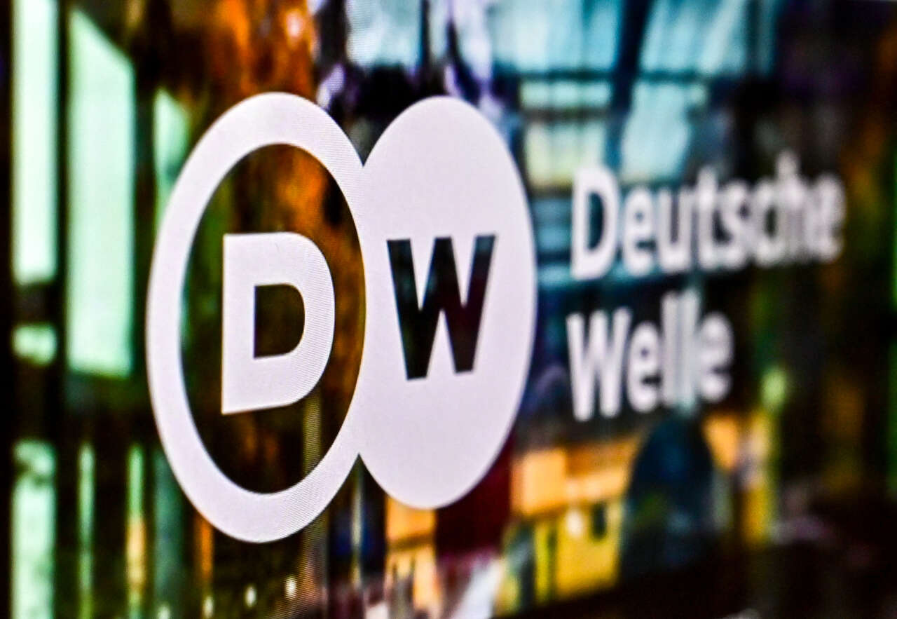 A photograph taken on February 3, 2022 shows the logo of German broadcaster "Deutsche Welle"  on a laptop screen in Moscow. - Russia said German broadcaster it is closing the Moscow bureau of German broadcaster Deutsche Welle and revoking staff accreditations in Russia, in response to Berlin's ban on the German-language channel of Russian state TV network RT. (Photo by Yuri KADOBNOV / AFP)