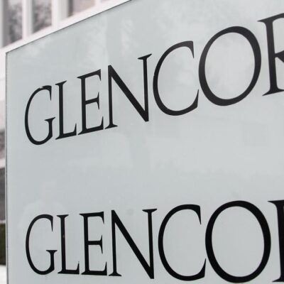 Logos are seen in front of Swiss commodities trader Glencore building in Baar near Zurich in this January 5, 2010 file photo. Commodities trading giant Glencore International plc plans to raise up to $12.1 billion in an initial public offering in London and Hong Kong, according to a term sheet seen by Reuters on Thursday. REUTERS/Christian Hartmann/Files (SWITZERLAND - Tags: BUSINESS)