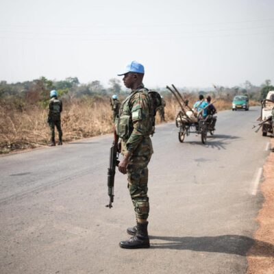Rwandan peacekeepers from the United Nations Multidimensional Integrated Stabilization Mission in the Central African Republic (MINUSCA) are deployed as check-points on the road from Bangui to Damara, where skirmishes took place during the week, on January 23, 2021. - The Coalition for Change (CPC), an amalgamation of several rebel groups, attacked Bangui with the aim of overthrowing outgoing president Faustin-Archange Touadera on January 13. Since then, loyalist forces have been mobilised on the outskirts of the capital, fearing a new offensive. (Photo by FLORENT VERGNES / AFP)