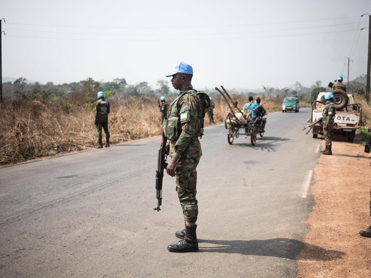 Rwandan peacekeepers from the United Nations Multidimensional Integrated Stabilization Mission in the Central African Republic (MINUSCA) are deployed as check-points on the road from Bangui to Damara, where skirmishes took place during the week, on January 23, 2021. - The Coalition for Change (CPC), an amalgamation of several rebel groups, attacked Bangui with the aim of overthrowing outgoing president Faustin-Archange Touadera on January 13. Since then, loyalist forces have been mobilised on the outskirts of the capital, fearing a new offensive. (Photo by FLORENT VERGNES / AFP)